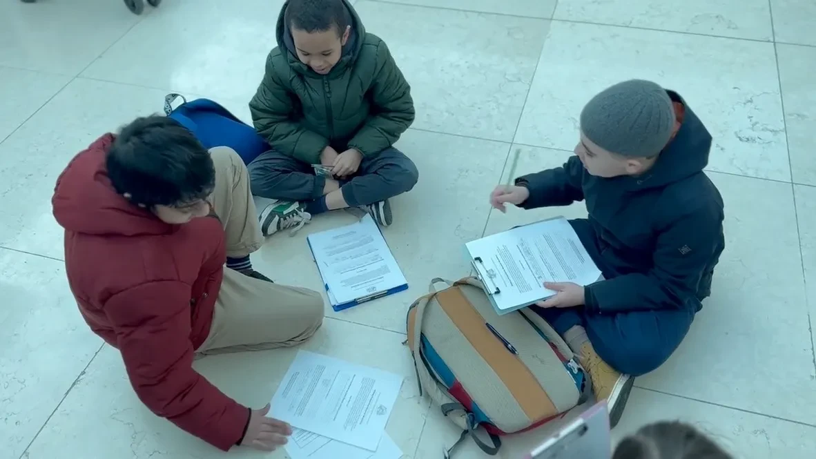Children reading together at a Forerunners book club session