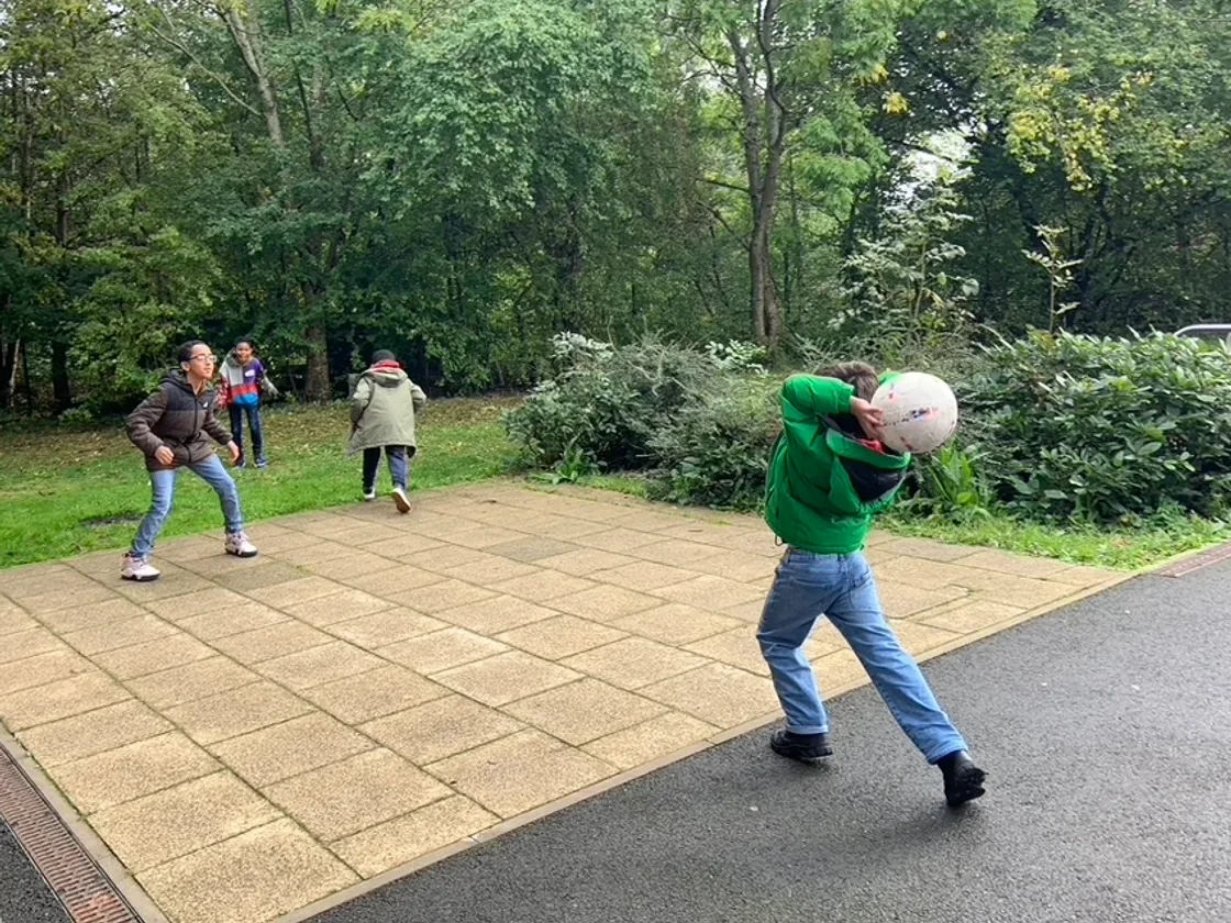Forerunners students playing together outdoors at a group day