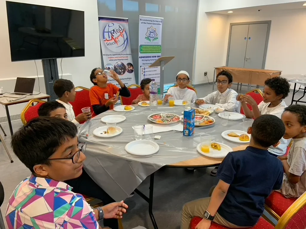 Families gathered at a Forerunners community event